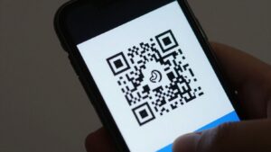 Smartphone scanning a Google QR code. Google qr code scanner