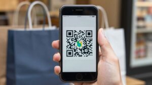 Smartphone displaying QR code for tax-free shopping in Japan. QR code transactions