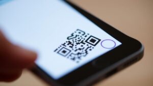Smartphone scanning a QR code.